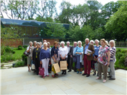 Group photo of the Williamson Friends, after their day at the Whitworth Art Gallery. See the beautiful Art Garden in the background.